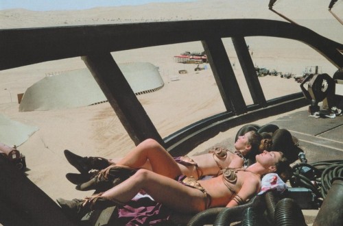 Carrie Fisher and her stunt double sunbathing on the set of Return of the 